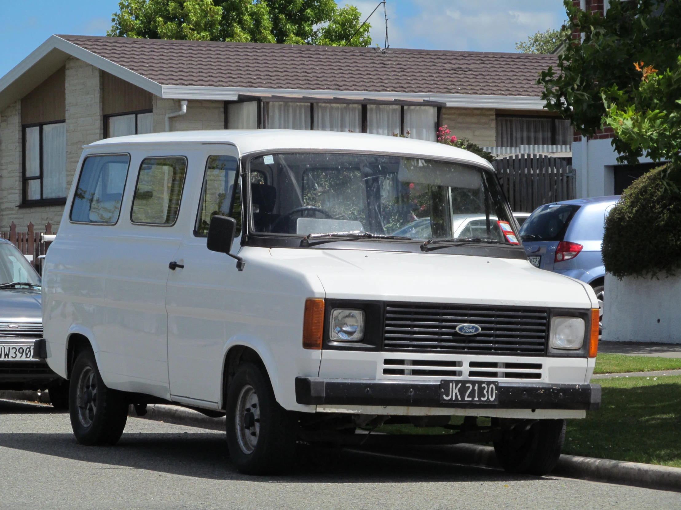 a white van parked on the side of the road