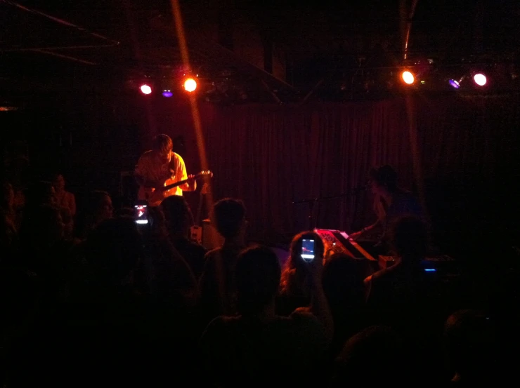 band playing in front of a full audience