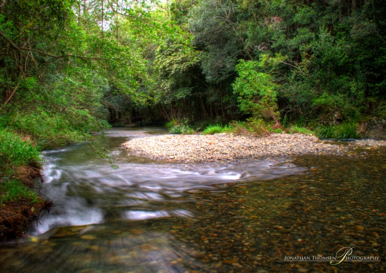 the small creek flows very fast across the land