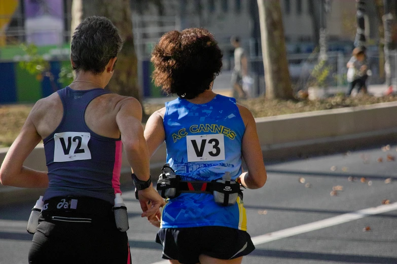 a couple running in an event on street