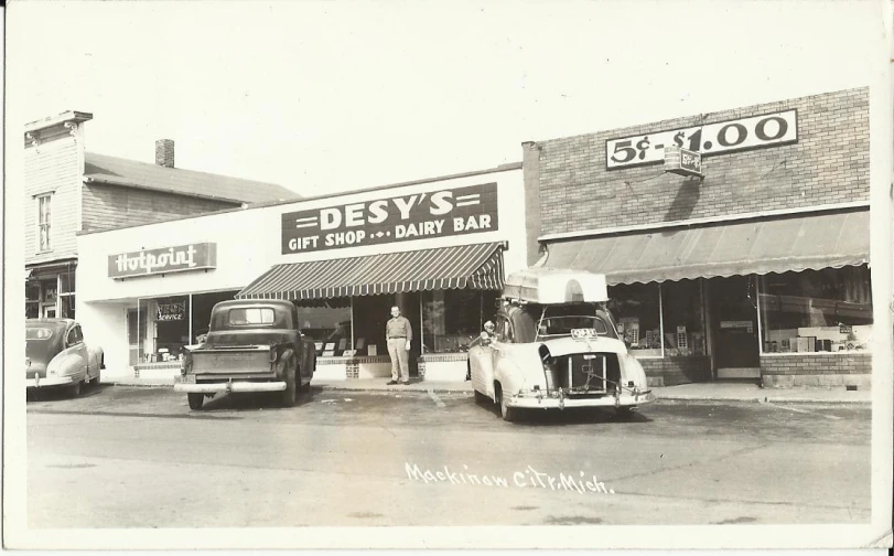 a truck and two trucks are parked outside of a restaurant