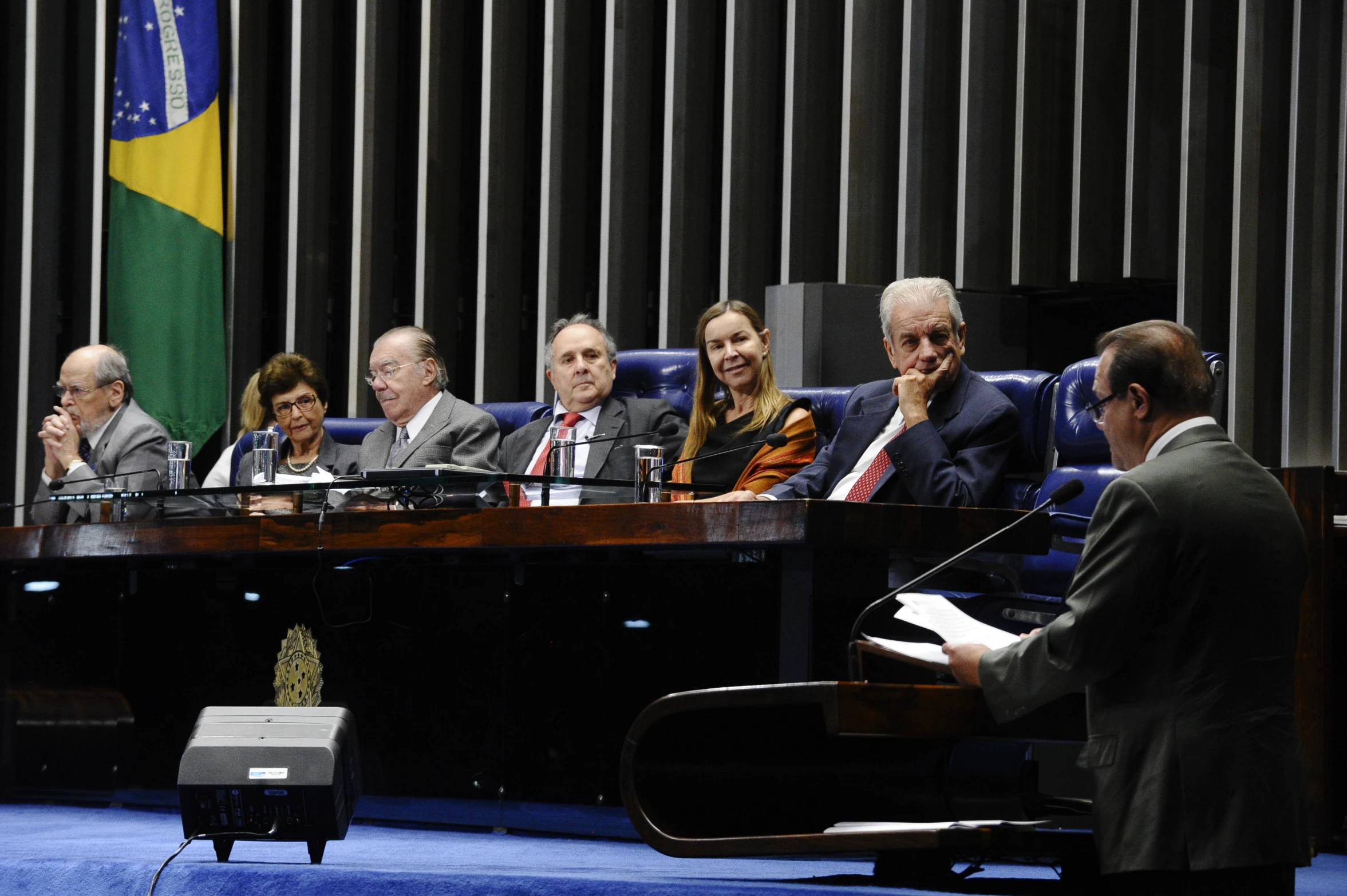 a group of people sitting at a table