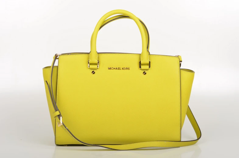 a yellow purse with one handle hanging