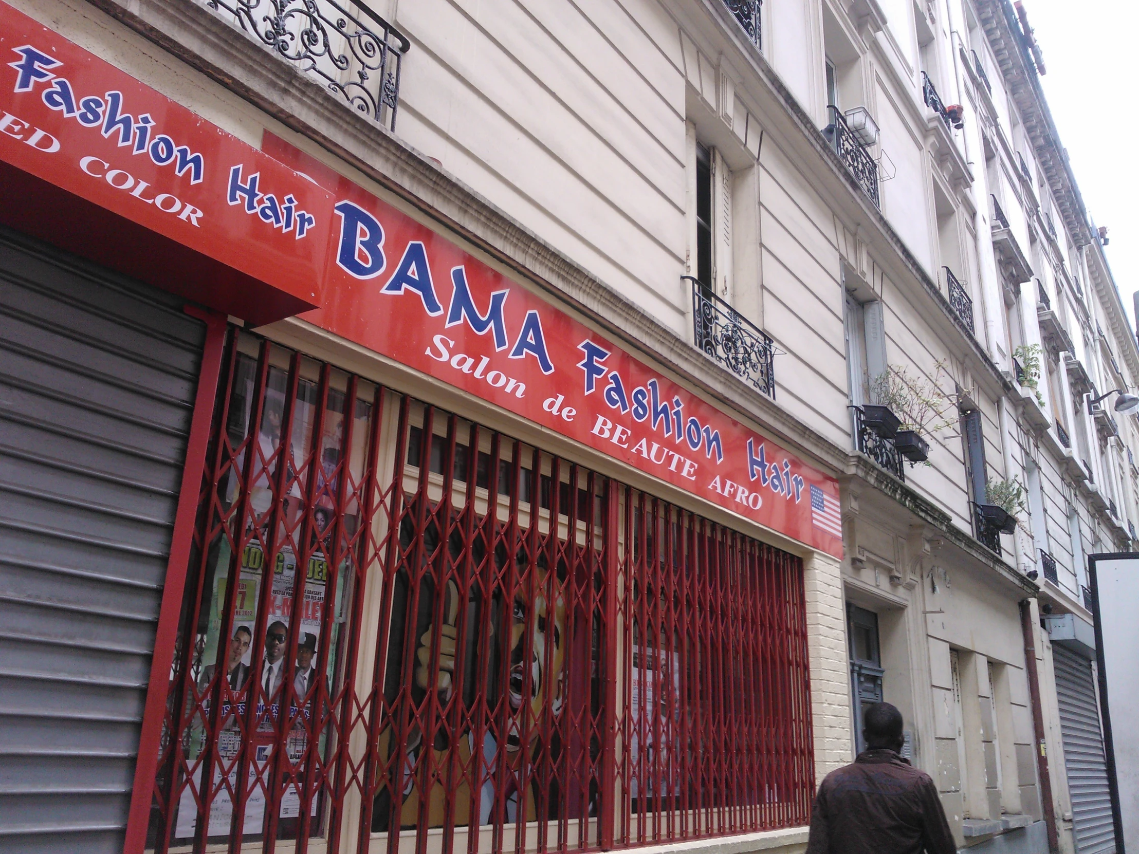 a red sign on the front of a store front