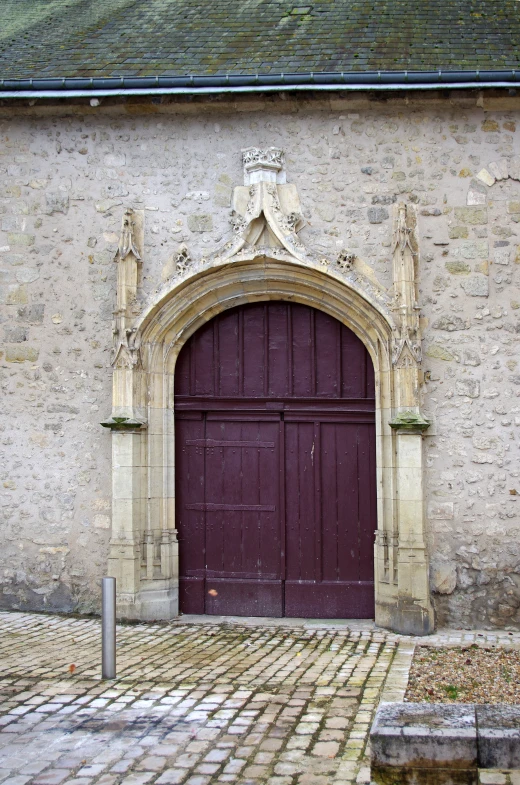 the front door to the old building has a horse figure on it