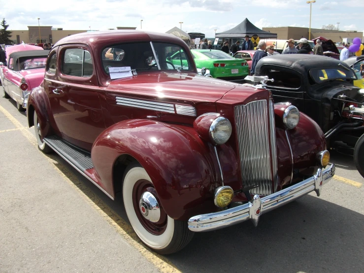 an antique car sits in a car show