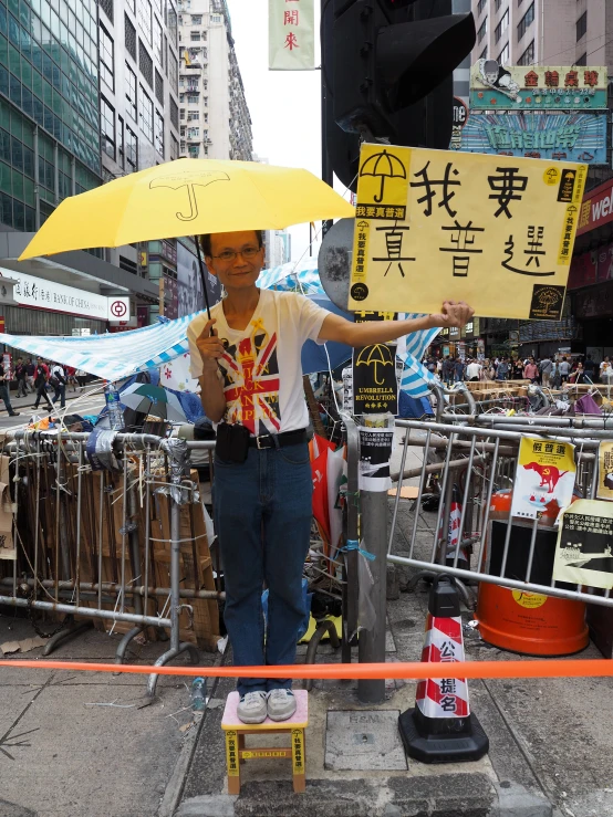  holding up an umbrella during the festival