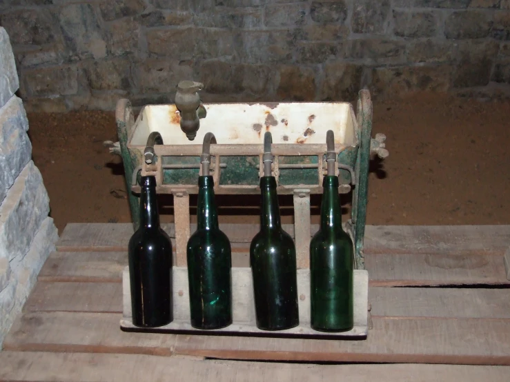 a wooden crate with some bottles inside of it