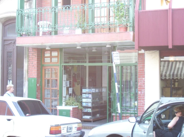 a car is parked outside of a bookstore