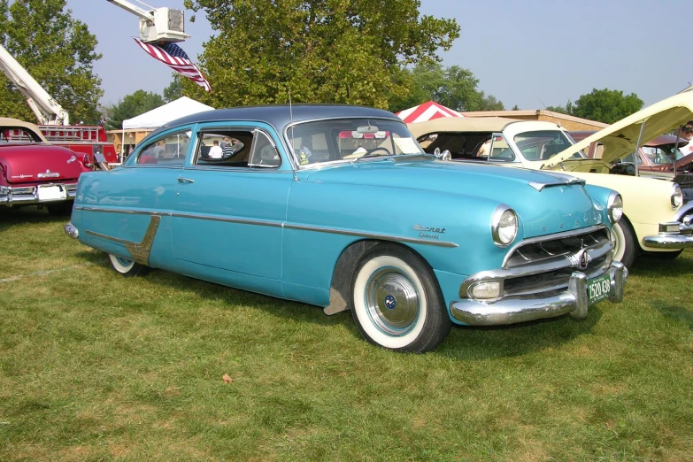 vintage car displayed at classic car show in the park