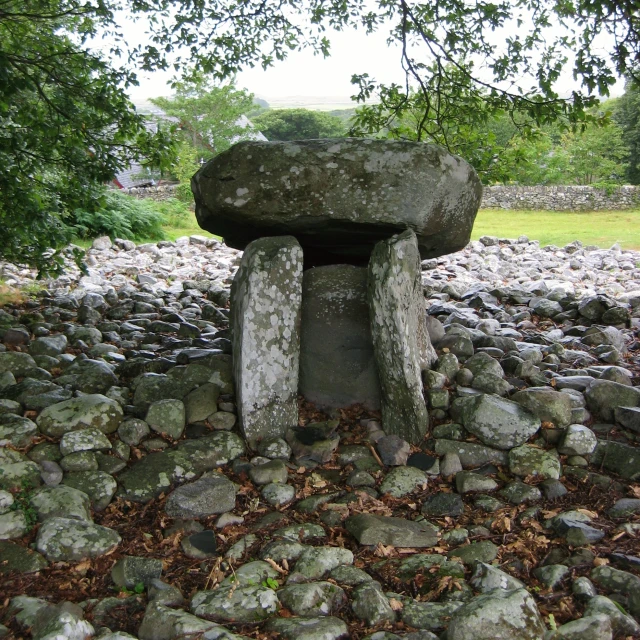 the large stone bench is placed between two trees