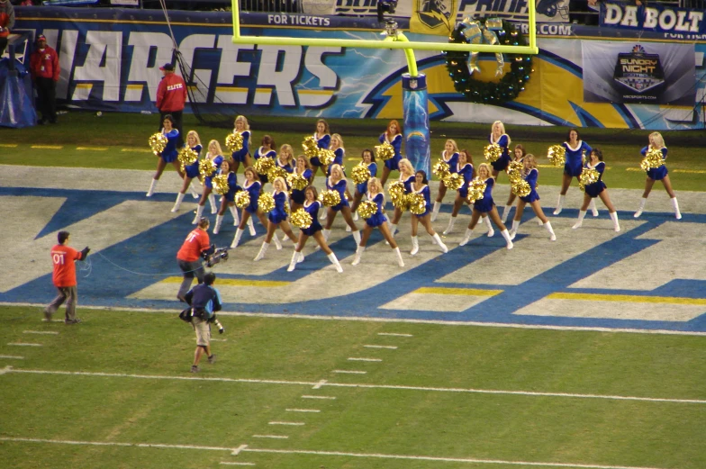 an image of a football game being played in the dark