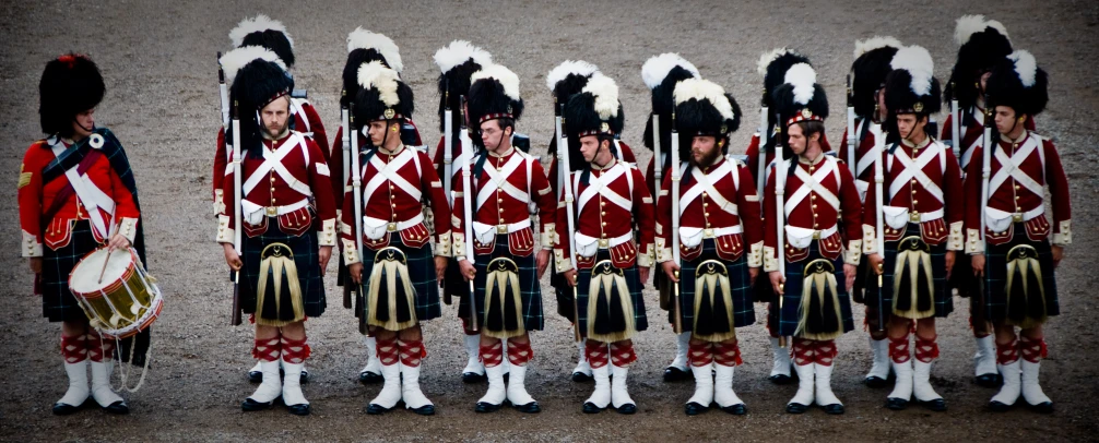 a group of men wearing military uniforms in parade