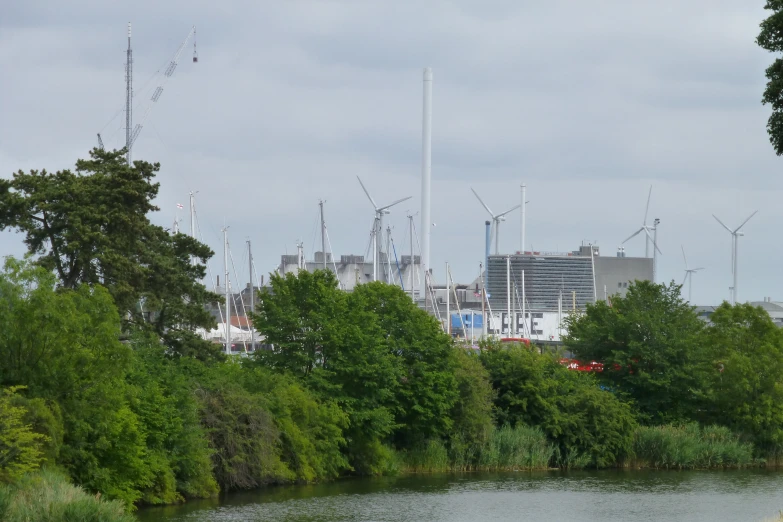 a river is seen running between tall buildings