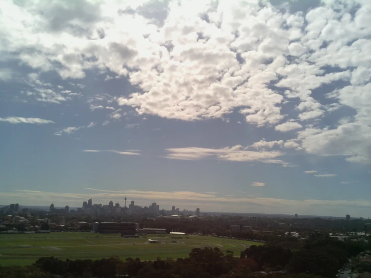 a plane flying over an overview of some city