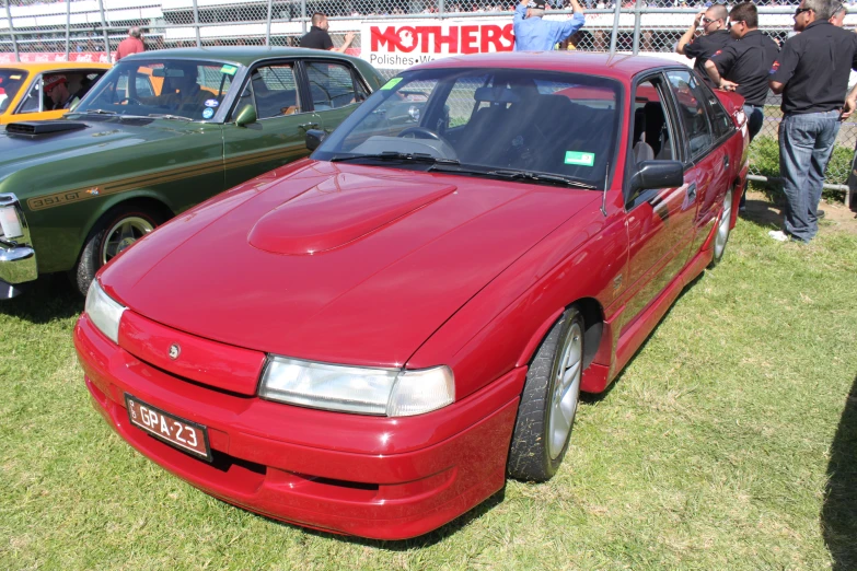 the cars are all red on display together