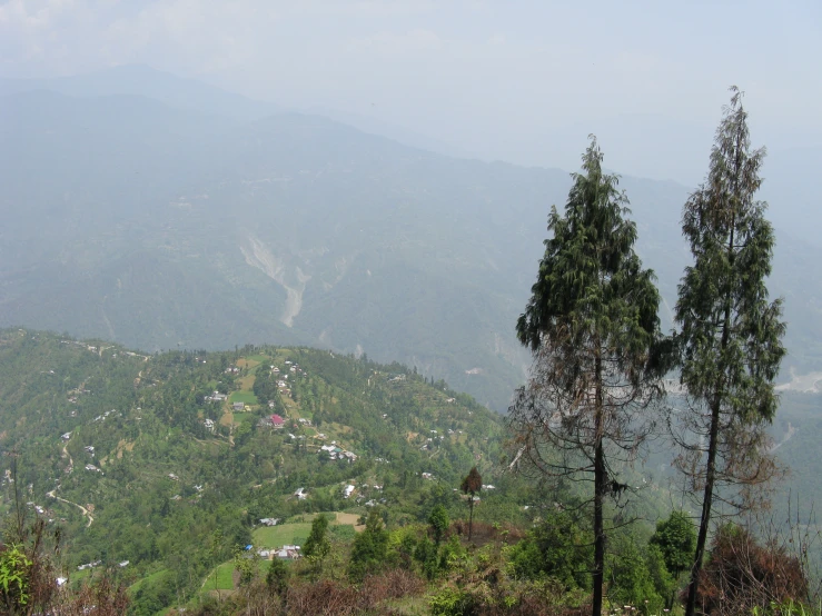 the view from a hill with houses on the hills