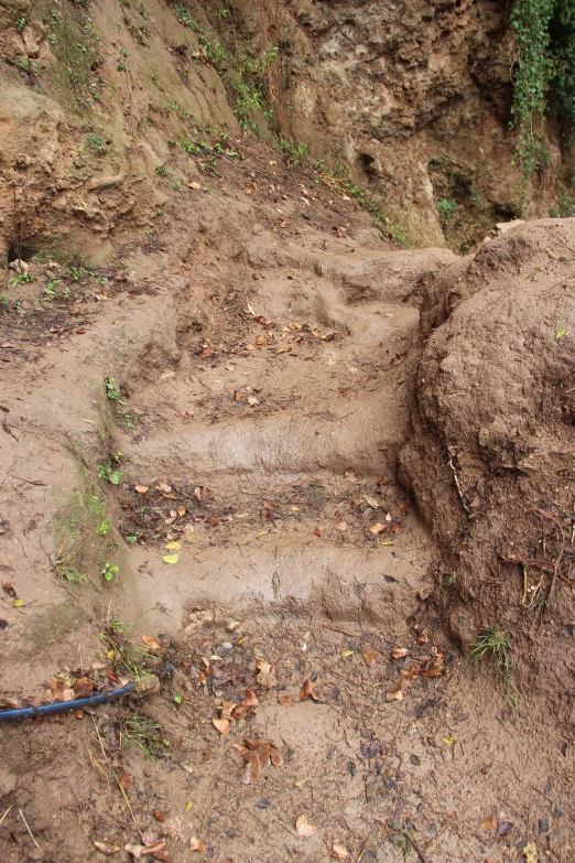 a large pile of dirt on the side of a road