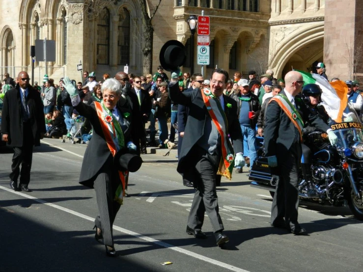 a couple of men walking down a street