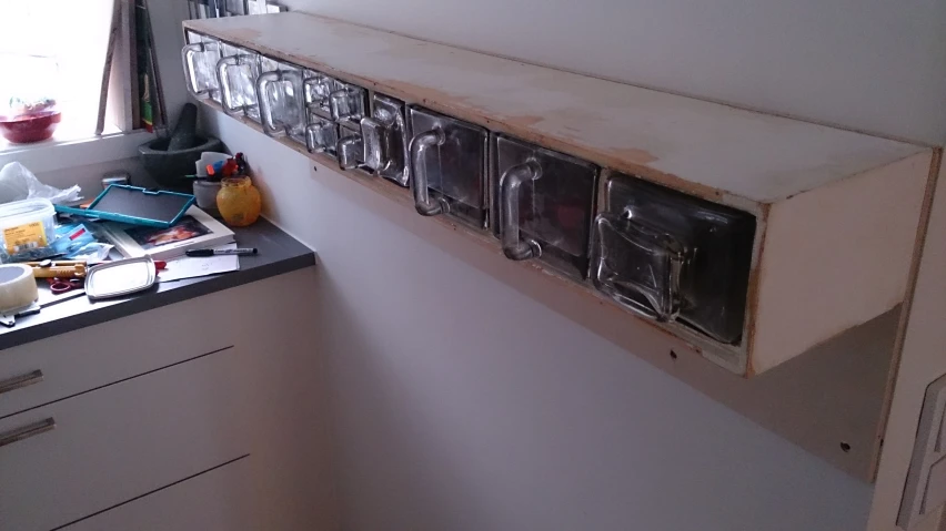 a kitchen with a counter and pots in the corner