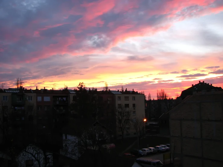 the sky is full of clouds and buildings