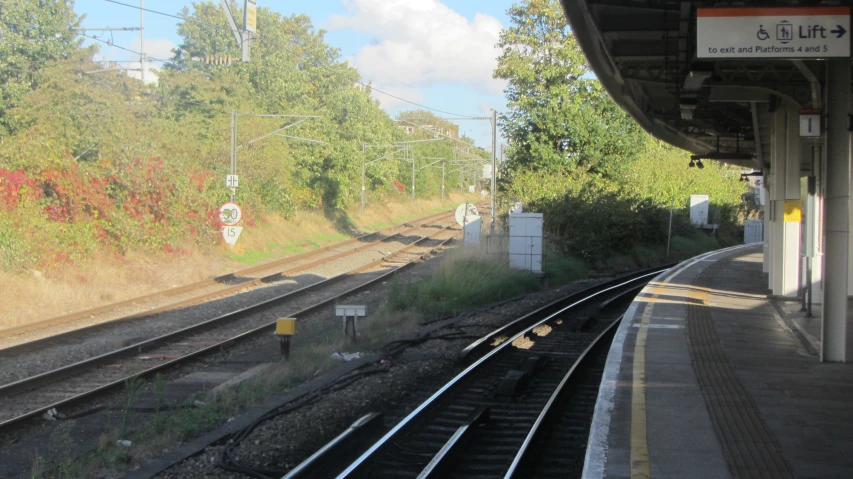 a set of train tracks next to a platform