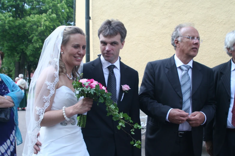 an elderly man and woman walk down the aisle of a wedding