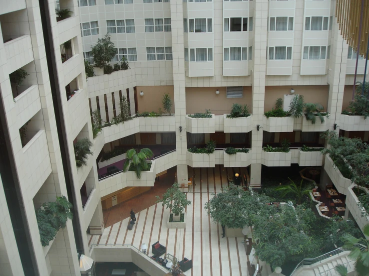 a el lobby with many plants in planters