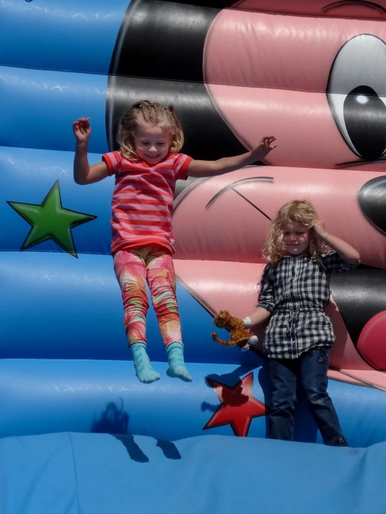 two children who are climbing in a castle