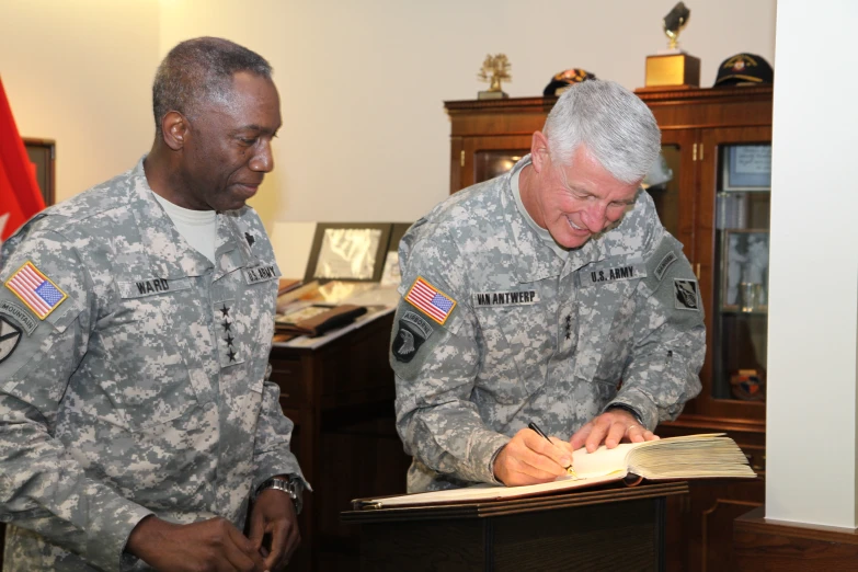 two military men standing next to each other