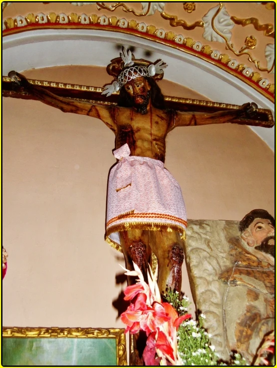 a religious artwork of jesus on the cross in a room