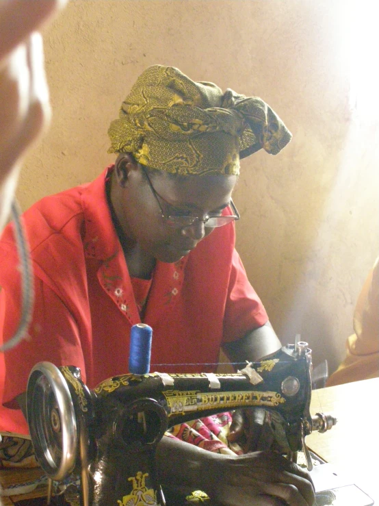 woman sewing on an old model vintage machine