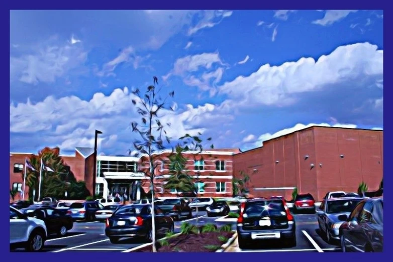 cars parked in a parking lot near a large building