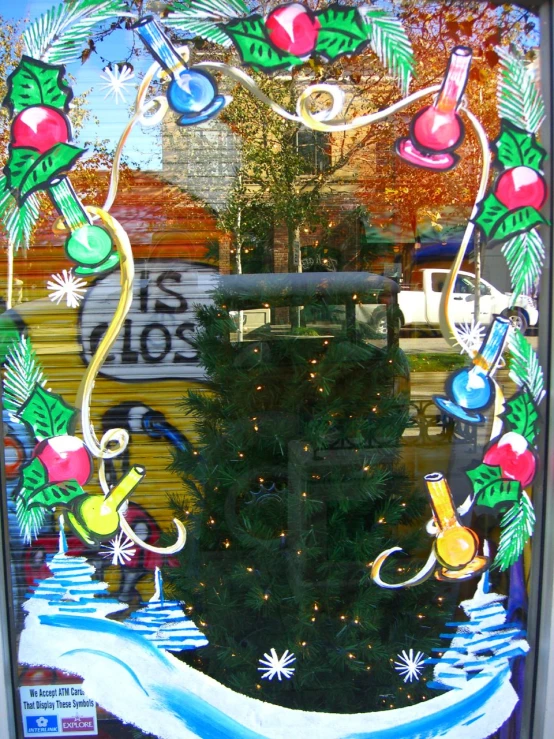 this is a stained glass window decorated with christmas decorations