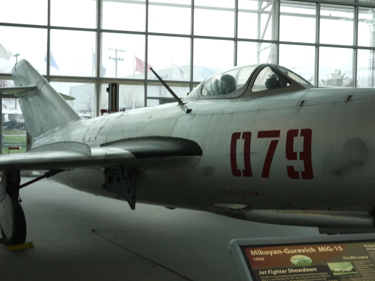 a small air plane sitting in a hanger