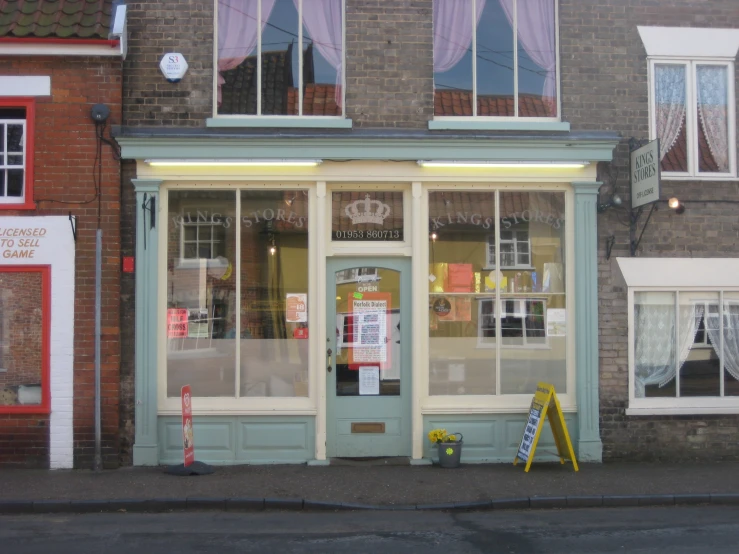 a store front in the town where people are selling items