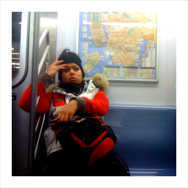 a person is sitting on the subway or train