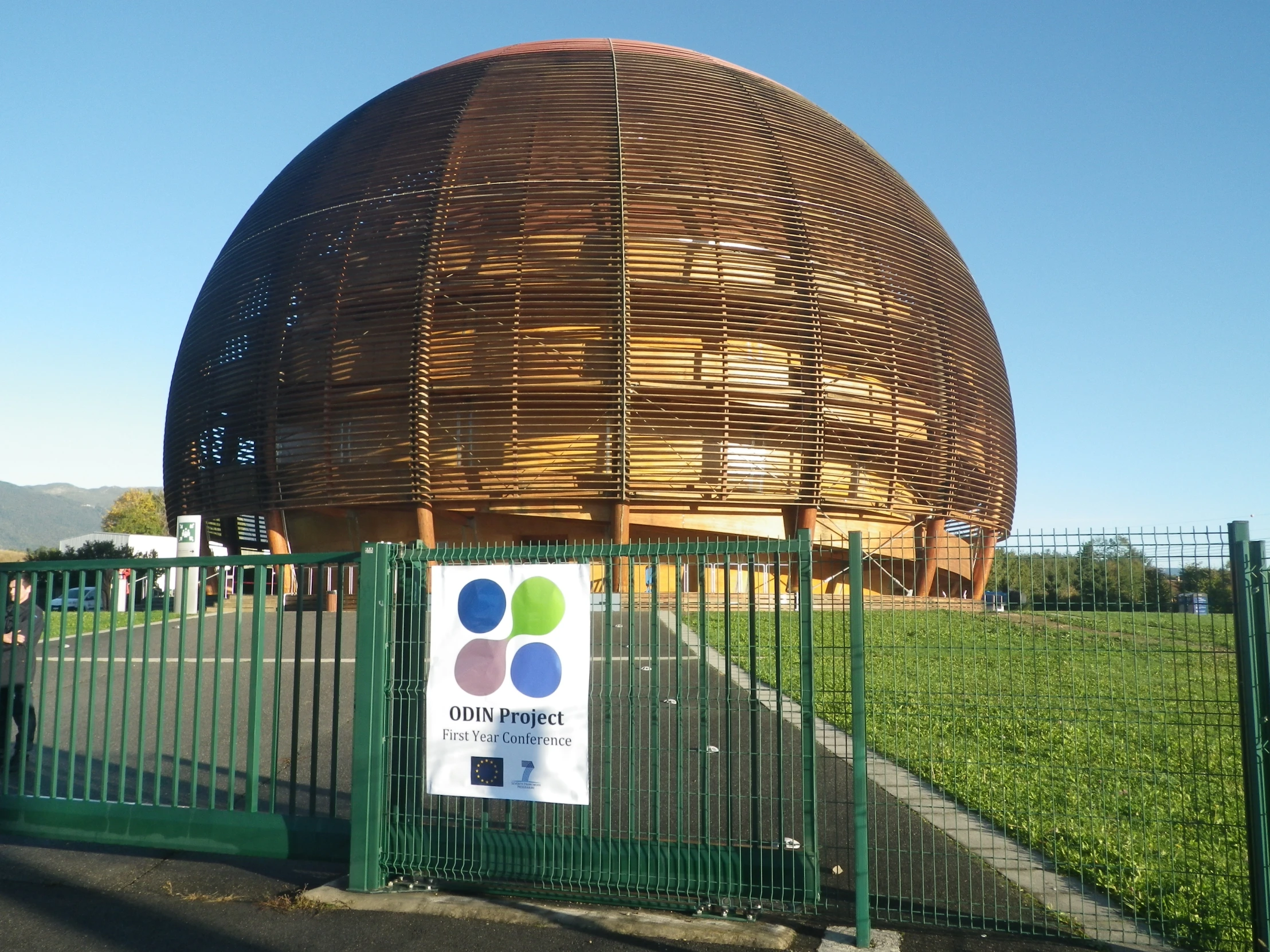 a small wooden dome is near a fence