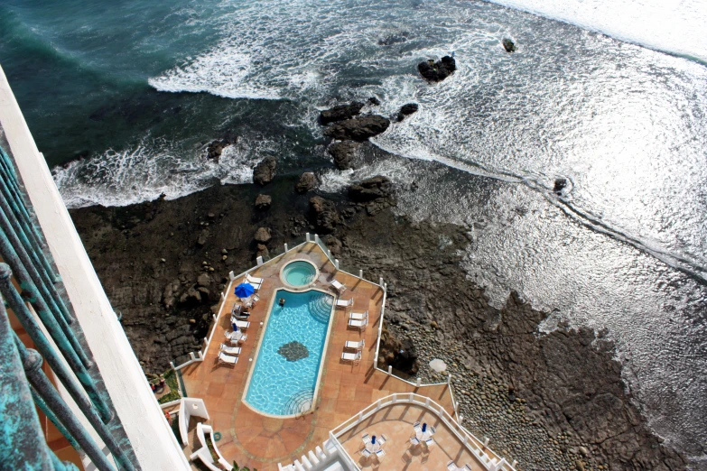 an aerial view of a resort near the ocean