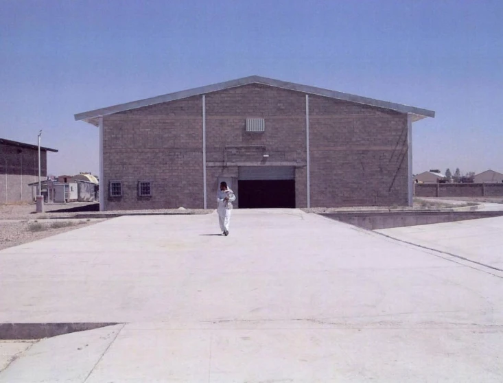 a person standing in the middle of an empty building