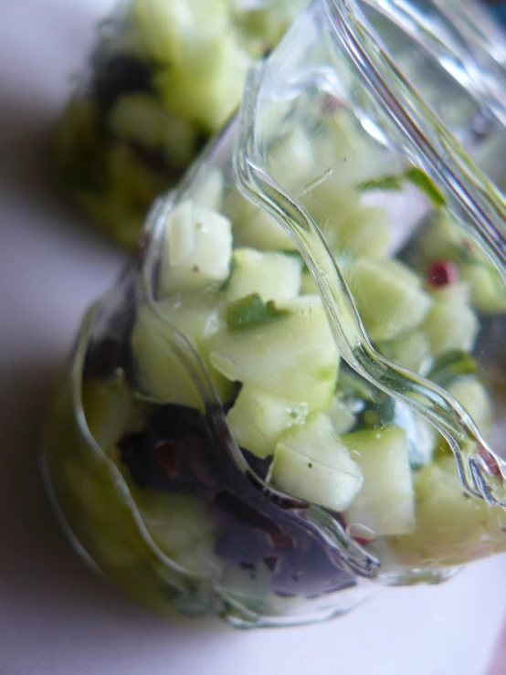 an image of a glass jar full of chopped fruit
