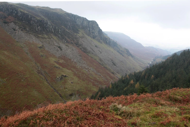 a mountain valley with many mountains on both sides