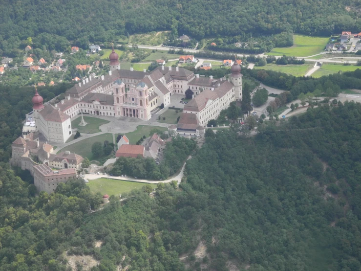aerial view of a historic, stately house on an incline