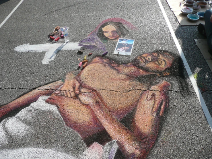 a man laying on the ground with a woman in it