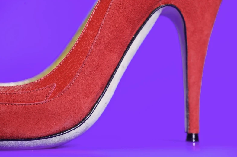 a high - heeled shoe with a white line down the side