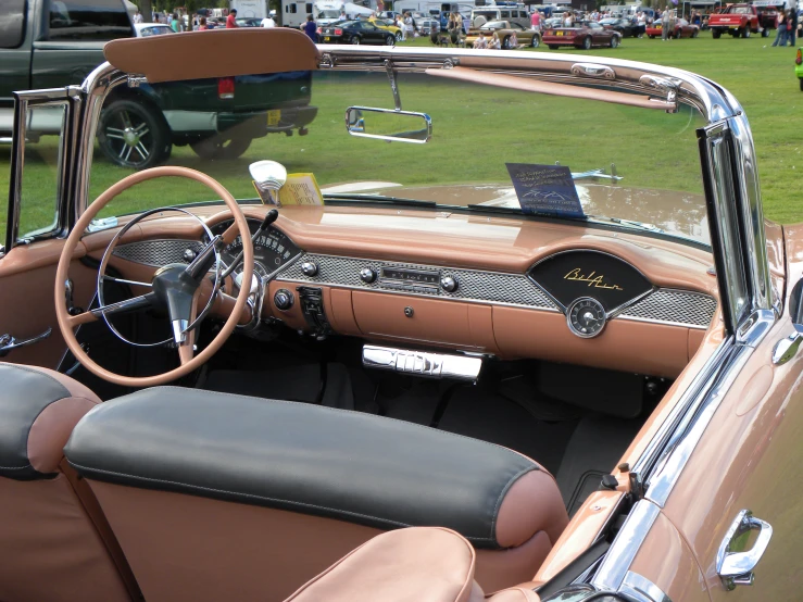 the interior of a car with brown leather and dashboard