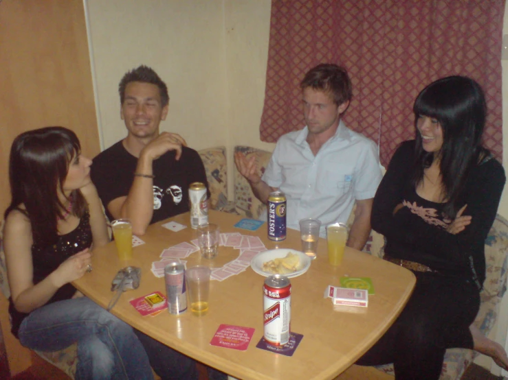 a group of people sitting around a table