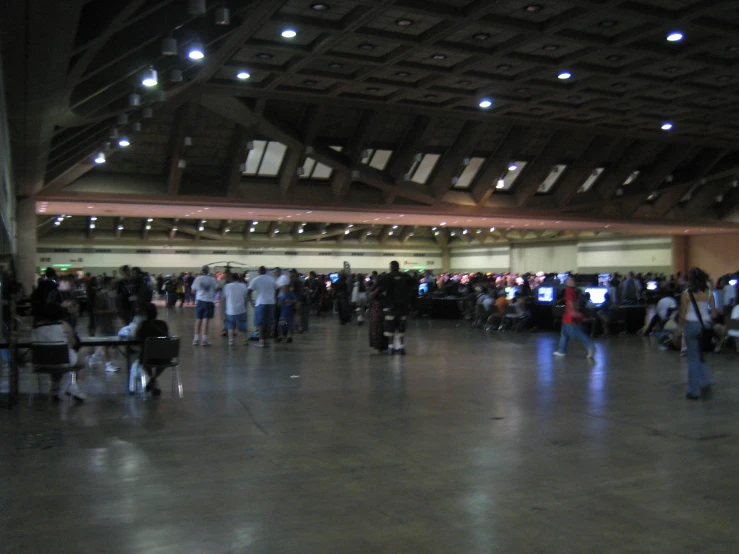 people are walking in an air port terminal