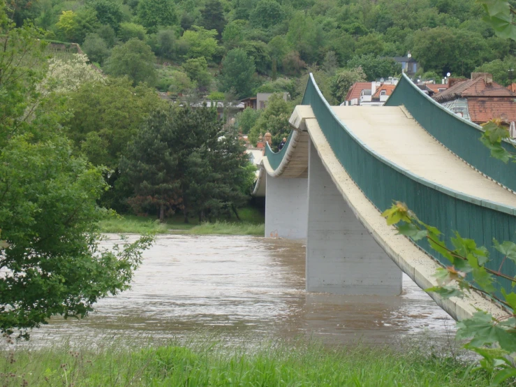 a road bridge with water flowing over it