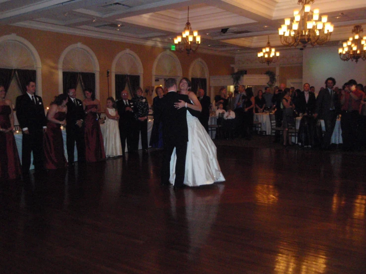 a bride and groom on their first dance